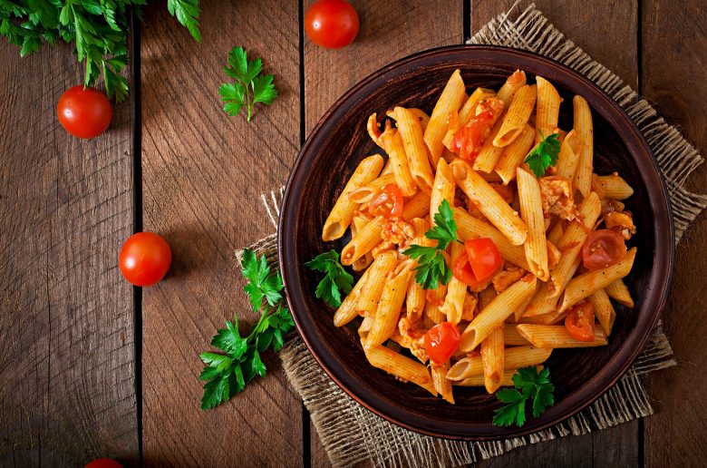 penne-pasta-tomato-sauce-with-chicken-tomatoes-wooden-table